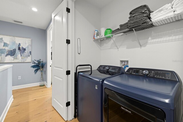 4311 W Fig St Unit 1, Tampa, FL 33609 - laundry area with washer and clothes dryer, light wood finished floors, and recessed lighting