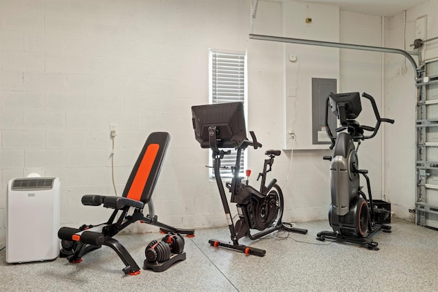 4311 W Fig St Unit 1, Tampa, FL 33609 - workout room with concrete block wall and electric panel