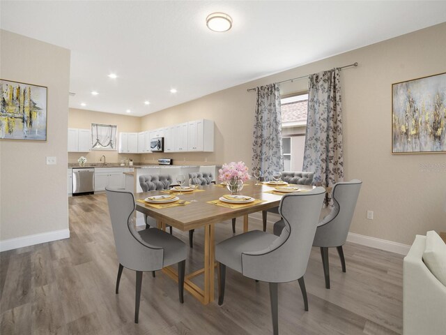 239 Burbank Ave, Lakeland, FL 33801 - dining area with light wood-style floors and recessed lighting