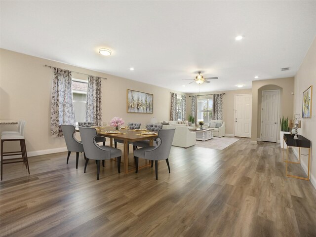 239 Burbank Ave, Lakeland, FL 33801 - dining space with plenty of natural light, a ceiling fan, wood finished floors, arched walkways, and recessed lighting