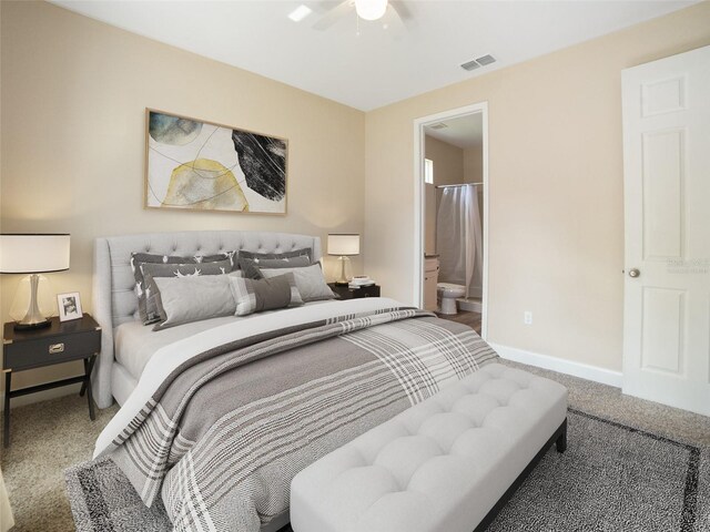 239 Burbank Ave, Lakeland, FL 33801 - carpeted bedroom featuring connected bathroom and ceiling fan