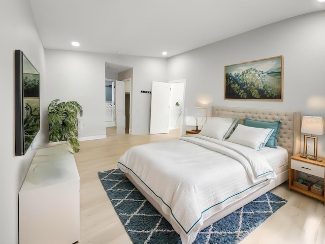 11653 Orleans Ln, Port Richey, FL 34668 - bedroom with light wood-style floors, recessed lighting, and ensuite bath