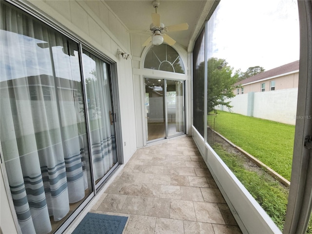11653 Orleans Ln, Port Richey, FL 34668 - unfurnished sunroom featuring ceiling fan and healthy amount of natural light