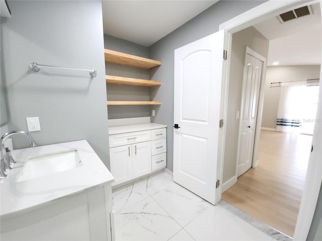 11653 Orleans Ln, Port Richey, FL 34668 - bathroom featuring vanity and marble finish floors