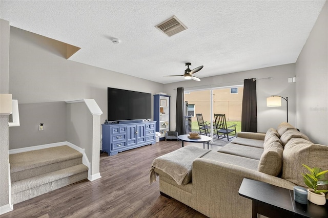 6919 Hawthorne Trace Ln, Riverview, FL 33578 - living room featuring stairs, a ceiling fan, wood finished floors, and a textured ceiling