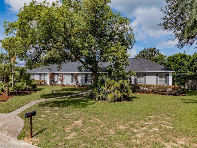1302 Ivywood Dr, Brandon, FL 33510 - single story home featuring a front lawn and roof with shingles