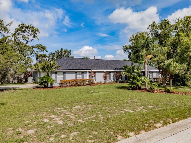 1302 Ivywood Dr, Brandon, FL 33510 - ranch-style house with a front lawn and driveway