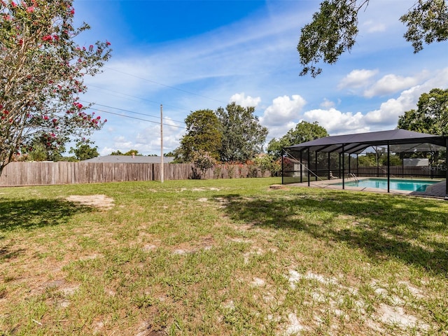 1302 Ivywood Dr, Brandon, FL 33510 - fenced backyard featuring glass enclosure