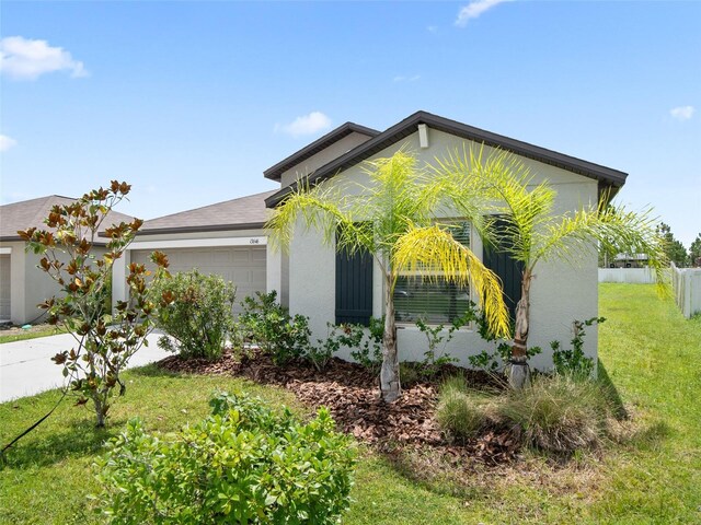 13646 Wild Ginger St, Riverview, FL 33579 - view of side of property with an attached garage, stucco siding, and driveway