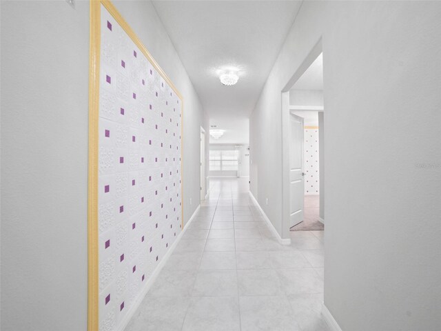 13646 Wild Ginger St, Riverview, FL 33579 - corridor featuring light tile patterned flooring and baseboards