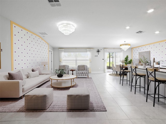 13646 Wild Ginger St, Riverview, FL 33579 - living area with a chandelier, tile patterned flooring, wallpapered walls, and recessed lighting
