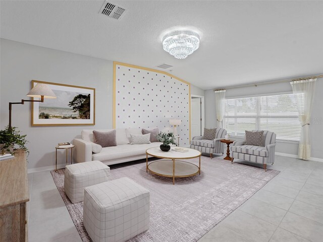 13646 Wild Ginger St, Riverview, FL 33579 - tiled living room with lofted ceiling and a chandelier