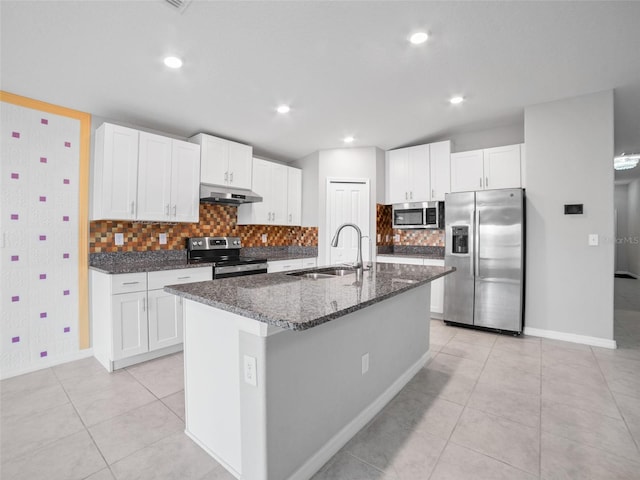 13646 Wild Ginger St, Riverview, FL 33579 - kitchen featuring appliances with stainless steel finishes, under cabinet range hood, light tile patterned flooring, tasteful backsplash, and recessed lighting