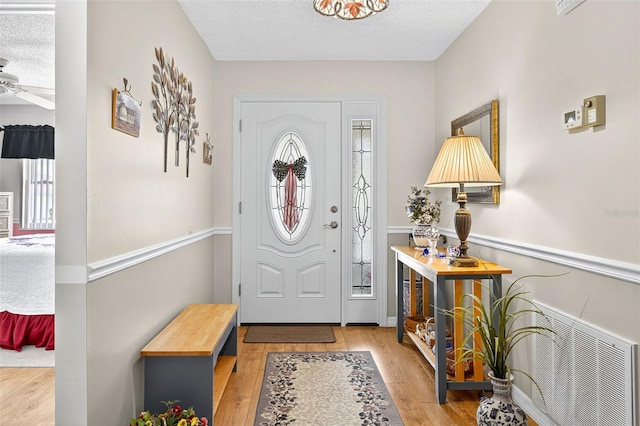 2201 Hartlebury Way Unit 2201, Sun City Center, FL 33573 - entryway featuring wood finished floors and a ceiling fan