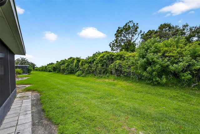 2201 Hartlebury Way Unit 2201, Sun City Center, FL 33573 - view of grassy yard