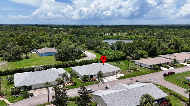 2201 Hartlebury Way Unit 2201, Sun City Center, FL 33573 - aerial view of residential area with a forest and a nearby body of water