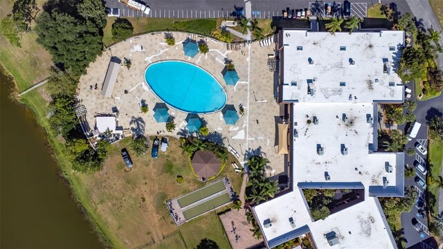 2201 Hartlebury Way Unit 2201, Sun City Center, FL 33573 - aerial view of property's location with a pool area and a nearby body of water