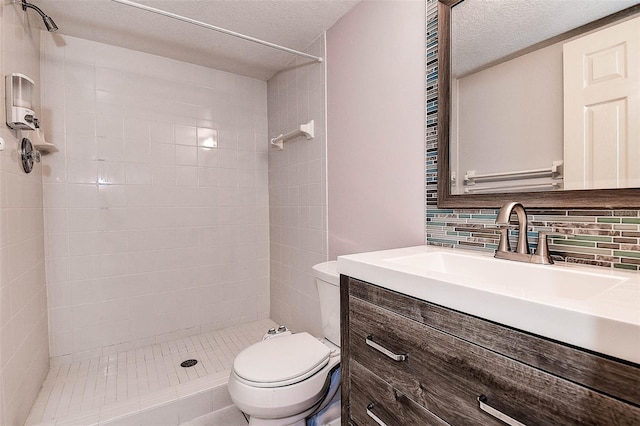 14865 Seminole Trl, Seminole, FL 33776 - bathroom with tiled shower, vanity, tasteful backsplash, and a textured ceiling