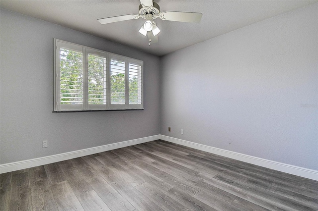 14865 Seminole Trl, Seminole, FL 33776 - unfurnished room with dark wood-type flooring and ceiling fan