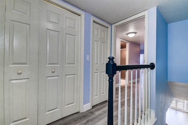 14865 Seminole Trl, Seminole, FL 33776 - hall featuring wood finished floors, a textured ceiling, and a textured wall