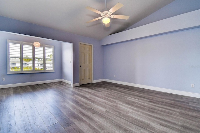 14865 Seminole Trl, Seminole, FL 33776 - empty room featuring lofted ceiling, dark wood finished floors, and ceiling fan