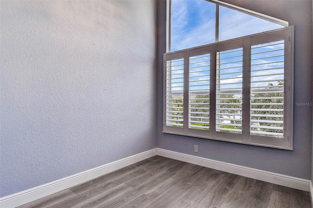 14865 Seminole Trl, Seminole, FL 33776 - unfurnished room with baseboards and dark wood finished floors
