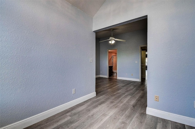 14865 Seminole Trl, Seminole, FL 33776 - spare room featuring a ceiling fan, dark wood finished floors, a textured wall, and lofted ceiling