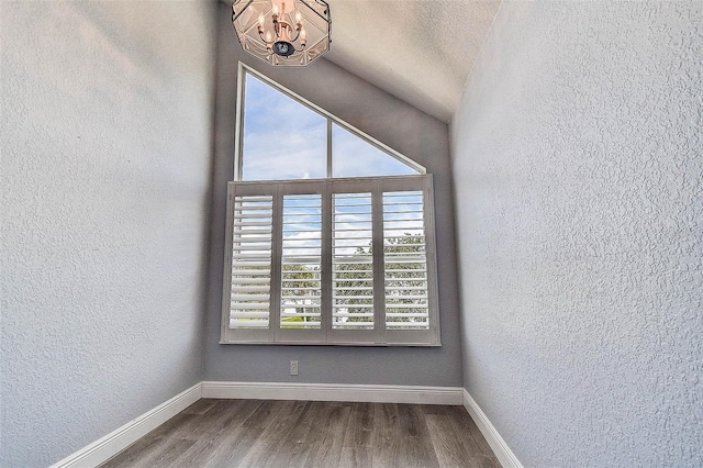 14865 Seminole Trl, Seminole, FL 33776 - spare room with a chandelier, wood finished floors, and a textured wall