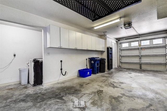 14865 Seminole Trl, Seminole, FL 33776 - garage featuring a garage door opener and baseboards