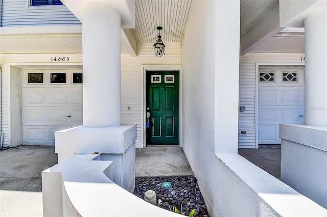 14865 Seminole Trl, Seminole, FL 33776 - doorway to property featuring a porch and a garage