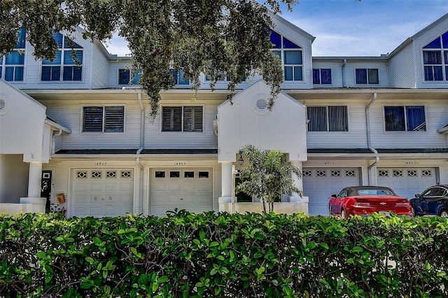 14865 Seminole Trl, Seminole, FL 33776 - townhome / multi-family property featuring an attached garage