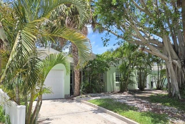 750 Bay Esplanade, Clearwater Beach, FL 33767 - view of front of property with driveway and stucco siding