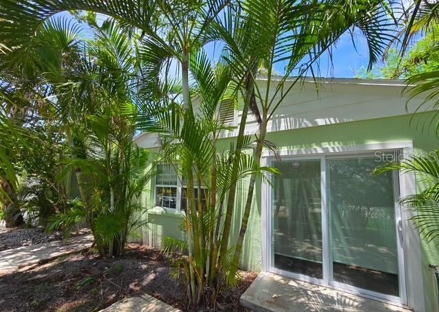 750 Bay Esplanade, Clearwater Beach, FL 33767 - view of side of home featuring a sunroom
