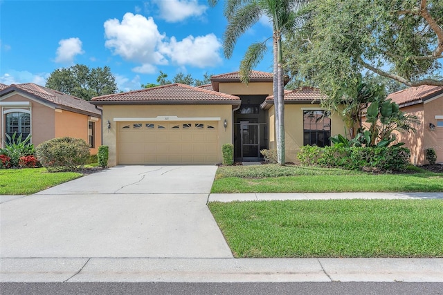 321 Silver Falls Dr, Apollo Beach, FL 33572 - mediterranean / spanish-style house featuring a garage, stucco siding, a tiled roof, concrete driveway, and a front yard
