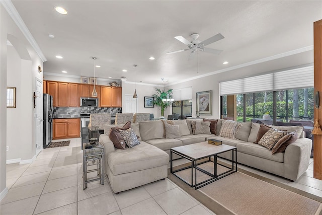 321 Silver Falls Dr, Apollo Beach, FL 33572 - living room with ceiling fan, ornamental molding, recessed lighting, and light tile patterned floors
