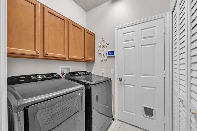321 Silver Falls Dr, Apollo Beach, FL 33572 - laundry area featuring washer and dryer, cabinet space, and light tile patterned floors