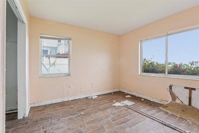 16033 Redington Dr, Redington Beach, FL 33708 - empty room featuring wood finished floors and baseboards