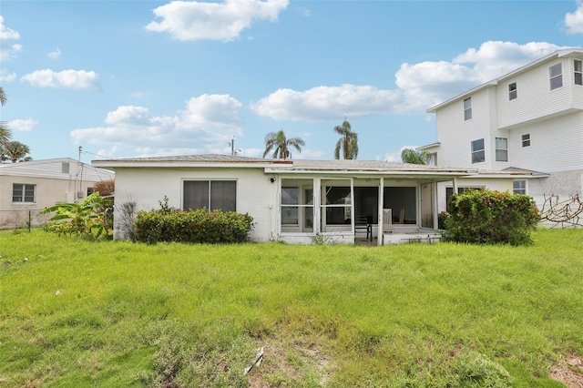 16033 Redington Dr, Redington Beach, FL 33708 - rear view of house featuring a sunroom and a shingled roof