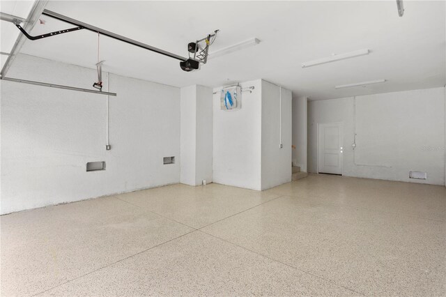 11605 1st St E Unit 2, Treasure Island, FL 33706 - garage featuring a garage door opener