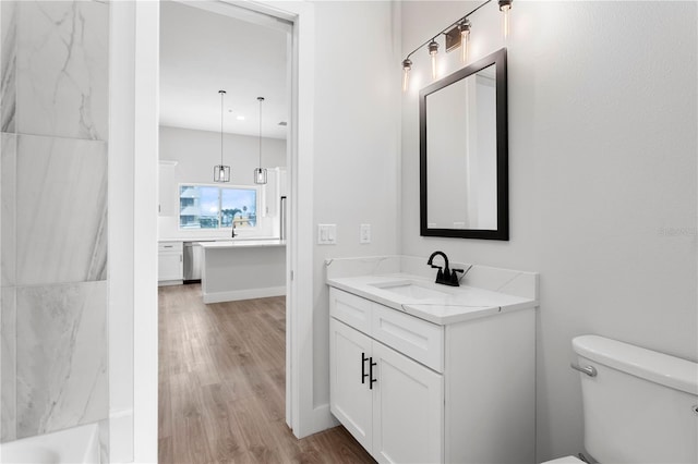 11605 1st St E Unit 2, Treasure Island, FL 33706 - full bath featuring vanity and wood finished floors