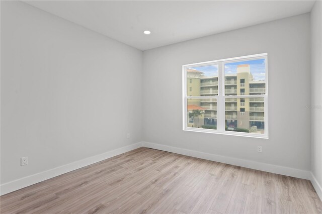 11605 1st St E Unit 2, Treasure Island, FL 33706 - empty room featuring wood finished floors and recessed lighting