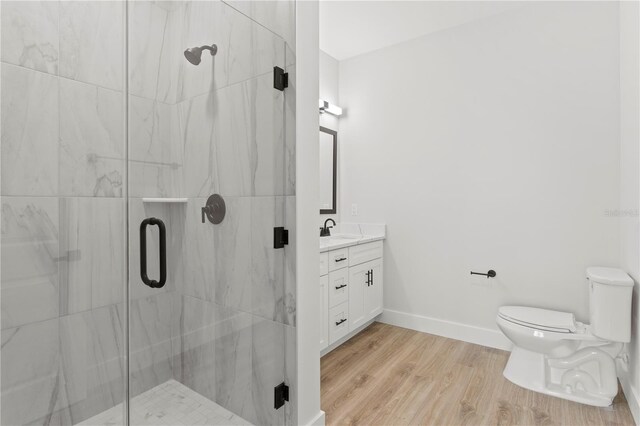 11605 1st St E Unit 2, Treasure Island, FL 33706 - full bath with vanity, a marble finish shower, and wood finished floors