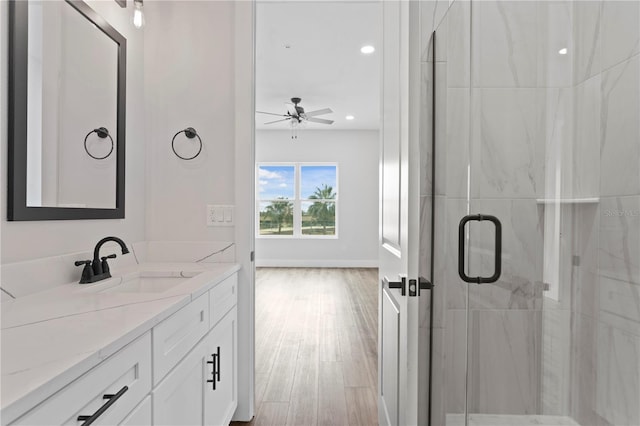 11605 1st St E Unit 2, Treasure Island, FL 33706 - bathroom featuring vanity, ceiling fan, a marble finish shower, wood finished floors, and recessed lighting
