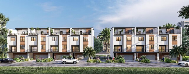11605 1st St E Unit 2, Treasure Island, FL 33706 - view of apartment building / complex featuring an attached garage and driveway