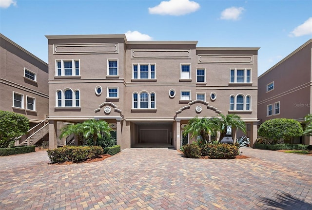 2756 Reserve Ct, Dunedin, FL 34698 - view of front of property featuring stucco siding and decorative driveway