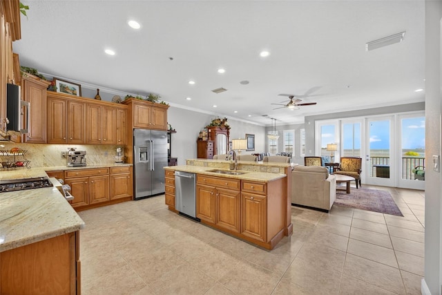 2756 Reserve Ct, Dunedin, FL 34698 - kitchen featuring crown molding, appliances with stainless steel finishes, recessed lighting, open floor plan, and a ceiling fan