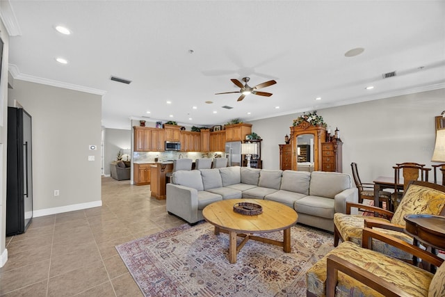 2756 Reserve Ct, Dunedin, FL 34698 - living area with ceiling fan, recessed lighting, light tile patterned flooring, and crown molding