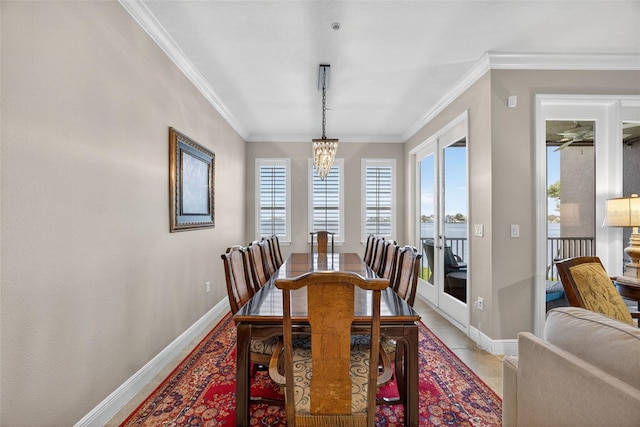 2756 Reserve Ct, Dunedin, FL 34698 - dining space with crown molding and a chandelier