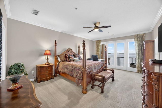 2756 Reserve Ct, Dunedin, FL 34698 - carpeted bedroom featuring access to exterior, ornamental molding, and ceiling fan