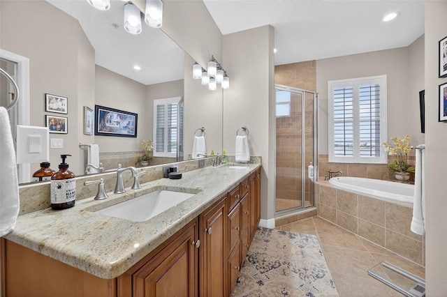 2756 Reserve Ct, Dunedin, FL 34698 - bathroom with double vanity, healthy amount of natural light, a stall shower, and recessed lighting